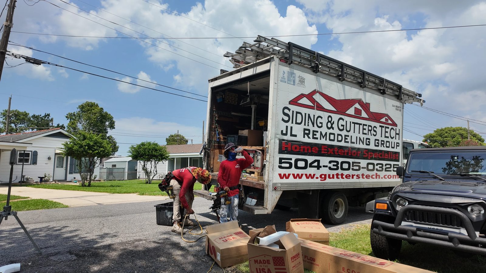 GuttersTech (JL Remodeling Group) crew and service truck on a siding and gutters job in Garden District, Louisiana