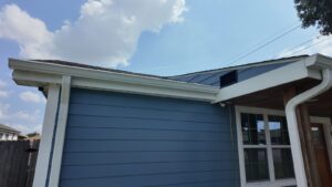 k style gutter closeup blue house
